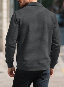Detail shot of men's casual dark grey shirt showing textured checkered quilted pattern on back