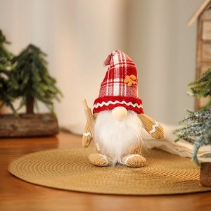Detailed view of Christmas gnome plush with rolling pin on a woven mat with warm decor