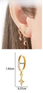 Detail of titanium ear hoops with star and moon charms, 8mm inner diameter measurements