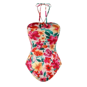 Detailed flat lay of floral ruffles one-piece swimsuit with neck tie and open back design
