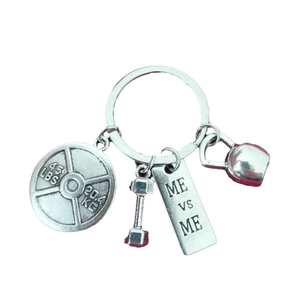 Silver fitness keychain with dumbbell kettlebell and ME VS ME engraved charms