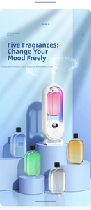 Macro detail of white aromatherapy machine with digital display and five scent bottles