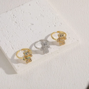 Three bear-shaped zircon open rings in gold and silver finish on white stone