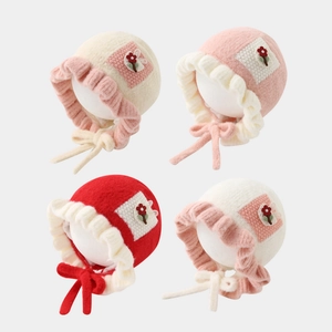 Winter knitted baby hats with floral embroidery and lace-up ear flaps in four colors