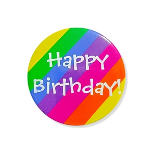 Detailed view of colorful rainbow striped birthday button badge with Happy Birthday text