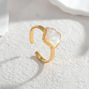 18K gold-plated stainless steel open ring featuring a white shell inlay on a stone surface