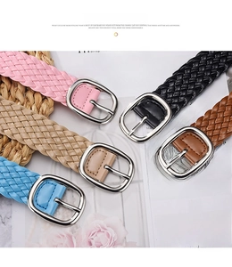 Flat lay of woven PU leather belts in five colors with oval silver buckles for dresses