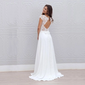 Elegant white lace backless wedding dress with a flowy chiffon A-line floor-length skirt