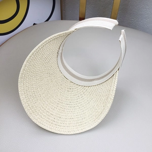 Detailed top view of beige straw open top sun hat with woven texture for kids