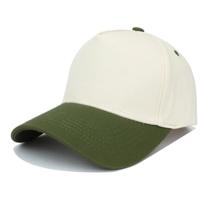 Detail view of contrast baseball cap showing beige crown and green brim stitching