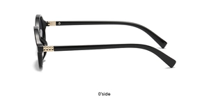 Side view of oval black sunglasses featuring golden metal hinges and polished frames