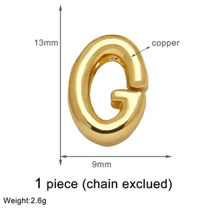 Macro view of gold-plated copper letter G pendant with size dimensions and weight info