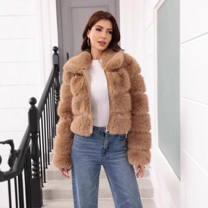 Detail of short brown faux fur jacket with a textured square-patterned design for women