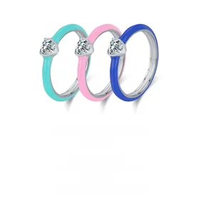 Macro detail of S925 sterling silver heart rings with colorful enamel and zircon stones