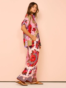 Detailed side view of vintage floral two-piece set with wide-leg pants in silky fabric