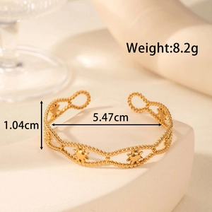 Adjustable golden stainless steel open bangle with cutout star patterns and size details