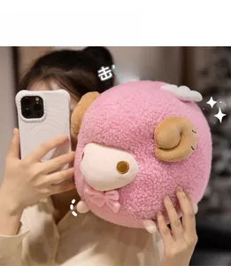 Close-up of a plush pink sheep doll with lamb wool texture and a cute pink bow tie