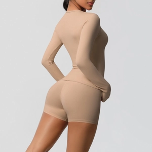 Detail view of skin-tight double-sided brushed yoga set with high waist shorts and long sleeves