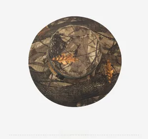 Top view of camouflage sun hat featuring realistic autumn forest leaves and wide brim detail