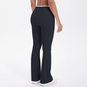 High-waisted black flare yoga pants with white contrast waistband showing back lift effect