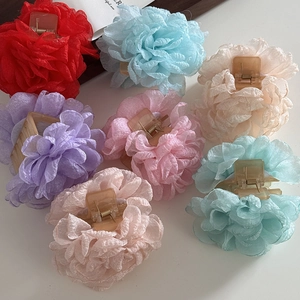 Floral fabric hair claws in assorted pastel colors for elegant summer styling