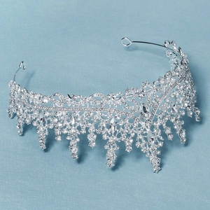 Detailed view of luxury bridal crown with purple crystals and silver leaf motifs