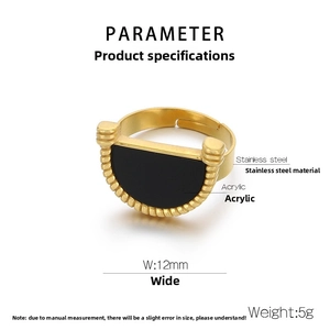 Detailed macro shot of an adjustable gold stainless steel ring with black acrylic inlay