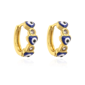 Detailed macro view of gold-plated evil eye hoop earrings with blue enamel hearts