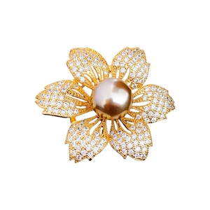Gold-plated cherry blossom brooch with pavé zircon petals and a large center pearl