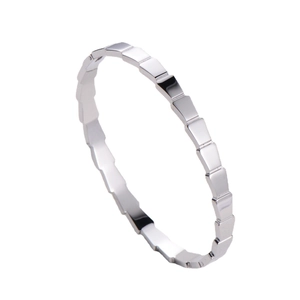 Polished silver geometric wave segment bangle with minimalist snap closure design