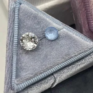 Titanium steel stud earrings featuring round brilliant cut white and blue sparkling crystals