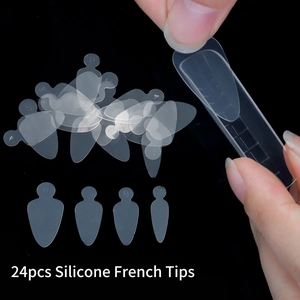 Detailed view of 24 flexible silicone French nail tip molds in various sizes