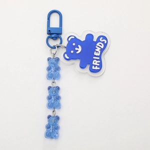 Blue cartoon bear keychain featuring a clear acrylic charm and gummy bear bead chain