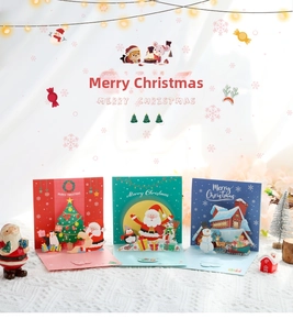 Detailed view of 3D Christmas pop-up cards with festive scenes and intricate paper art
