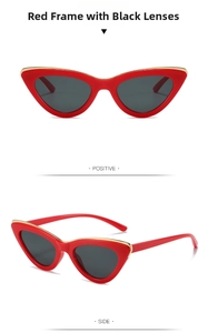 Detail view of red cat-eye sunglasses with gold metal trim and dark gray lenses