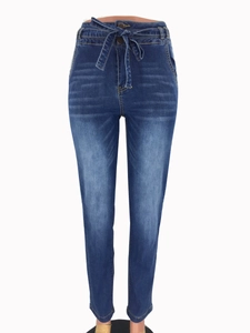 Close-up of high-waisted dark blue denim jeans with matching fabric belt and whiskers