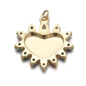 Detailed macro view of a heart-shaped golden metal pendant with colorful crystal accents