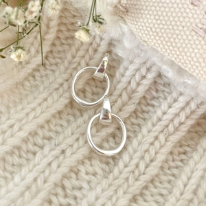 S925 sterling silver geometric hoop earrings with polished finish on soft knit texture