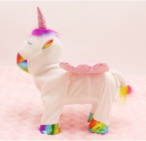 Side view of walking unicorn plush toy with white fur, pink wings and rainbow mane details