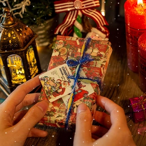 Vintage Christmas sticker book with festive ribbon and Santa tag in a cozy holiday setting