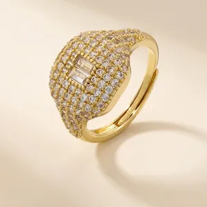 Adjustable 18K gold plated brass ring featuring sparkling square zirconias and pave setting