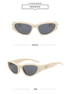 Detail view of beige cat-eye Y2K sunglasses with silver star decor and grey lenses