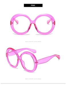 Front and side view of oversized round pink glasses frame with transparent finish