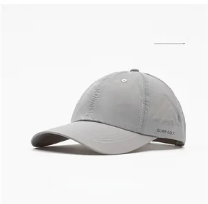 Detail of white quick-dry golf cap showing breathable laser-cut side perforations