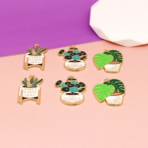Detailed enamel plant pendants featuring Monstera and Crazy Plant Lady designs