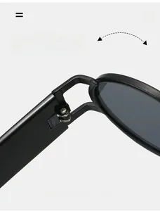 Close-up of durable metal hinge on vintage small frame black sunglasses for durability