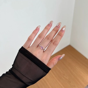 Close-up of S925 silver ring featuring heart-shaped pink zircon and side accent stones