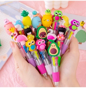 Close-up of cute cartoon multi-color ballpoint pens with various animal and fruit tops