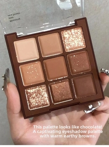 Macro shot of 9-color earthy brown eyeshadow palette with matte and shimmer finishes