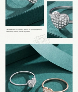 Detailaufnahme herzförmiger Ringe in Silber und Roségold mit Mikro-Pave-Kristallen